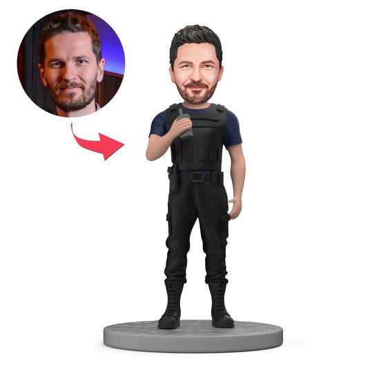 Personalised policeman bobblehead in body armour holding a walkie-talkie, handmade polymer clay desk ornament — custom face gift for him