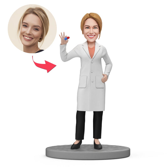 Custom female pharmacist bobblehead holding a pill — personalised face gift bobblehead for GP, chemist, nurse or colleague, bespoke polymer clay mini‑me figurine