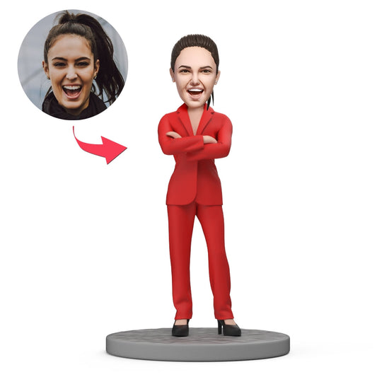 Personalised polymer clay bobblehead of a businesswoman in a red suit (standing) — handcrafted Boss's Day corporate gift for her