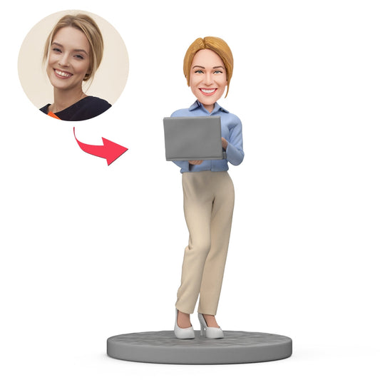 Personalised female boss bobblehead working with laptop, polymer clay collectible — ideal Boss's Day gift and gifts for boss or colleagues in the UK and Australia