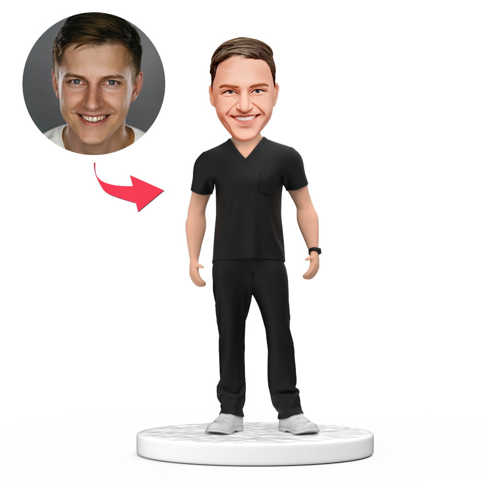 Personalised male doctor bobblehead in black scrubs, handmade polymer‑clay doctor figurine with engraved base — engraved doctor gift, ideal NHS thank you or GP graduation present (UK & Australia)