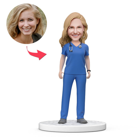 Custom female doctor bobblehead in blue scrubs with personalised engraved base — handcrafted polymer clay desk ornament gift for doctors