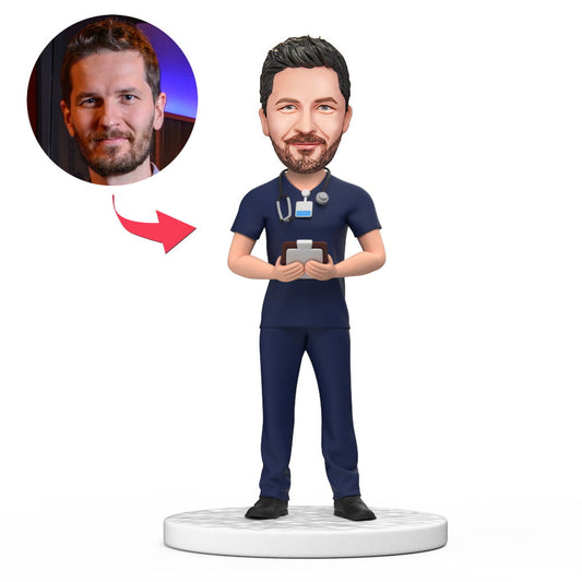 Handmade personalised male doctor bobblehead in dark blue scrubs with engraved base, polymer clay desk keepsake ideal as a personalised Doctor's Day, graduation or thank-you gift