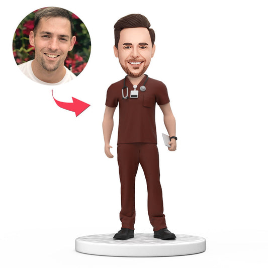 Handmade personalised male doctor bobblehead in red scrubs with custom face and engraved base - polymer clay keepsake ideal for National Doctor's Day, NHS appreciation, graduation or Father's Day gift