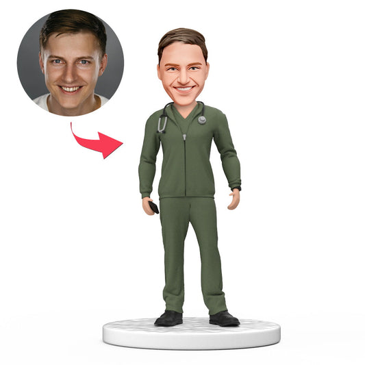 Personalised male doctor bobblehead in green scrubs with white jacket, handcrafted polymer clay, engraved name option – ideal National Doctor’s Day or medical graduation gift