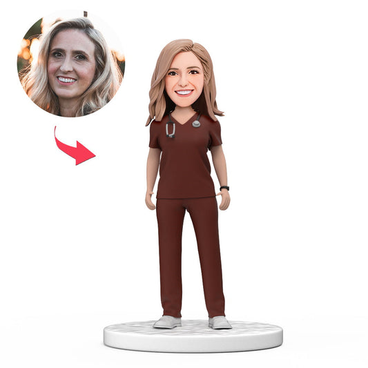 Personalised female doctor bobblehead in red scrubs — handcrafted polymer clay figurine with customised head from your photos and engraved base, ideal medical graduation or NHS doctor gift
