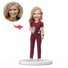 Custom Female Doctor Bobblehead in Red Holding a Tablet Scrubs with Engraved Text National Doctor's Day Gift