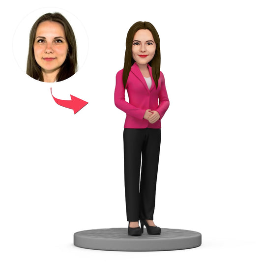 Custom business woman bobblehead in pink business attire with personalised face – polymer clay personalised face gift, ideal custom bobblehead Australia and personalised bobble head UK