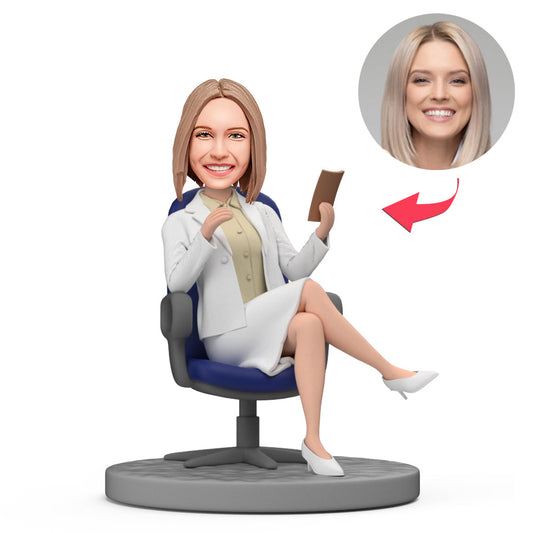 Personalised Lady Boss bobblehead seated on a chair holding documents – ideal Boss's Day gift and desk ornament