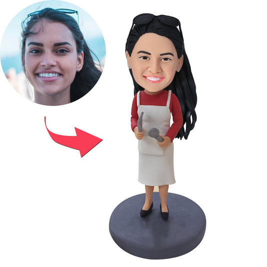 Personalised female cook bobblehead in apron with engraved text on base, polymer clay custom chef gift and kitchen keepsake
