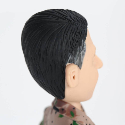 Detail of engraved base with custom name and message on personalised soldier bobblehead — engraved bobblehead keepsake for service members