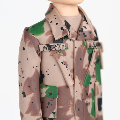 Close-up of personalised soldier bobblehead head customised from a photo, showing facial likeness and hairstyle for a custom male bobblehead