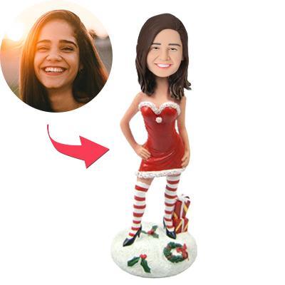 Personalised Christmas Bobblehead — sexy Christmas woman in red outfit holding gifts, handcrafted polymer clay custom bobblehead with engraved name on base