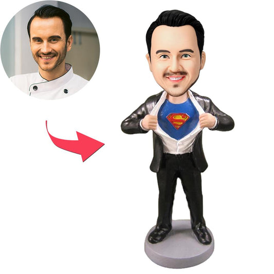 Superman Strip personalised bobblehead with engraved text — polymer clay figurine featuring a custom head (face and chosen hairstyle) on a classic Superman outfit; engraved bobblehead gift