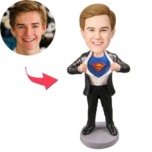 Personalised Superman Strip bobblehead — polymer clay figure with custom engraved head and fixed Superman-style body, front view showing personalised face, hairstyle and engraved name on the base