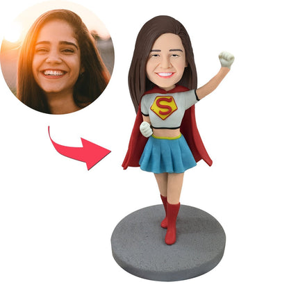 Supergirl personalised bobblehead — hand-crafted polymer clay standing figure with custom head from your photo and engraved base, perfect personalised gift
