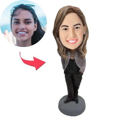 Female in business wear personalised bobblehead with custom head portrait and engraved text on the base — polymer clay professional desk keepsake