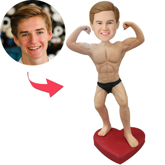 Custom bodybuilder bobblehead personalised from your photo — premium polymer clay standing figure with sculpted muscular torso and engraved text on the base, ideal personalised gym gift