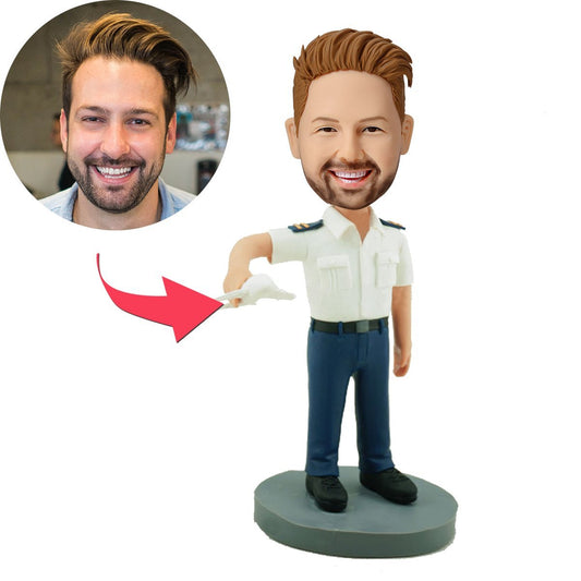 Front view of a personalised pilot bobblehead holding a model plane, hand-sculpted from polymer clay with a customised likeness and engraved base — a custom pilot gift and model plane bobblehead keepsake