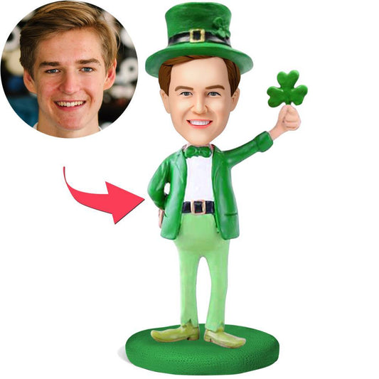 St. Patrick's Day personalised bobblehead in green outfit, handcrafted polymer clay with personalised head sculpt and engraved name plaque — ideal engraved keepsake gift