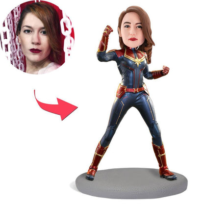 Captain Marvel inspired personalised bobblehead, front view showing customised polymer clay head and engraved text on the base — perfect personalised superhero gift