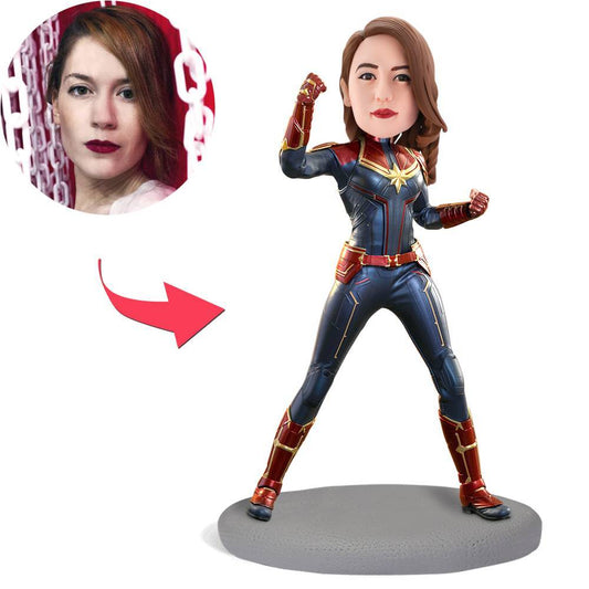 Captain Marvel inspired personalised bobblehead, front view showing customised polymer clay head and engraved text on the base — perfect personalised superhero gift