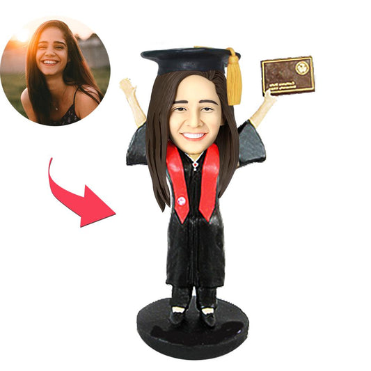Handmade personalised graduation girl bobblehead with custom polymer clay head — perfect keepsake graduation gift for daughters, sisters and friends; body, pose and outfit as pictured
