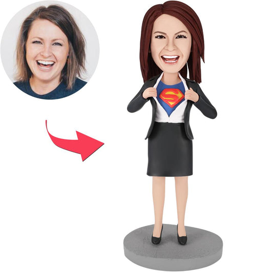 Office Superwoman custom bobblehead – hand-made polymer clay desk ornament with personalised head and professional outfit, ideal personalised corporate desk gift and office novelty