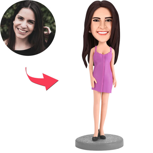 Custom woman bobblehead wearing a purple skirt – personalised polymer clay figure with a customised head and engraved text on the base