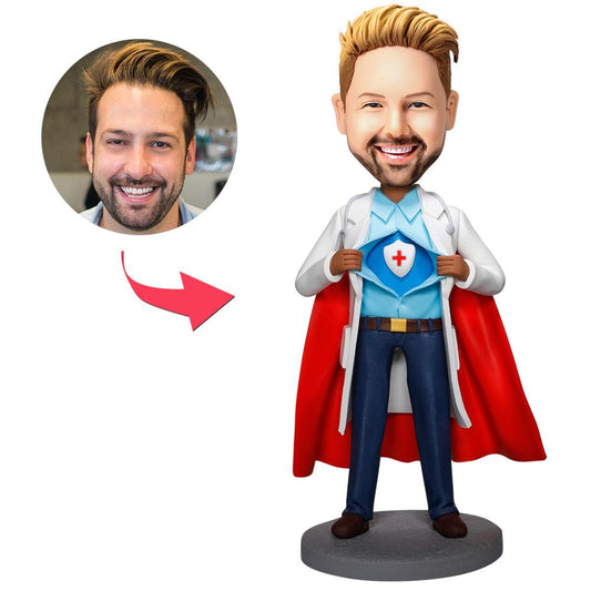 Hand-crafted polymer clay personalised Super Doctor bobblehead holding a medical shield with engraved base and custom head – perfect personalised doctor gift and custom doctor bobblehead
