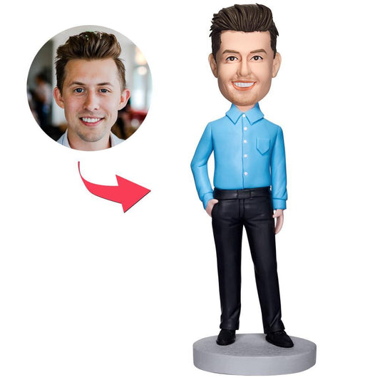 Personalised executive bobblehead of a man in a blue shirt, polymer clay custom head matched to your photo with engraved base for name or short quote — ideal personalised corporate or office gift
