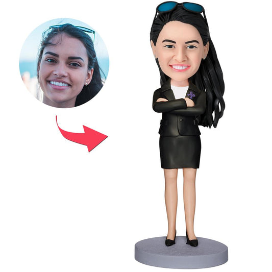 Executive woman personalised bobblehead — handcrafted polymer clay desk ornament with engraved text on the base, custom head matched to photo; ideal personalised corporate gift for a boss