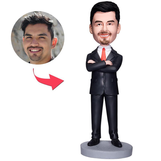 Personalised business man bobblehead with arms folded – polymer clay desk ornament showing customised head likeness and engraved text on base, ideal corporate gift