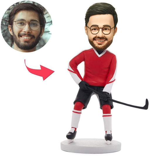 Personalised polymer clay hockey player bobblehead in red kit with a custom head made from your photo and engraved name on the base, ideal sports gift