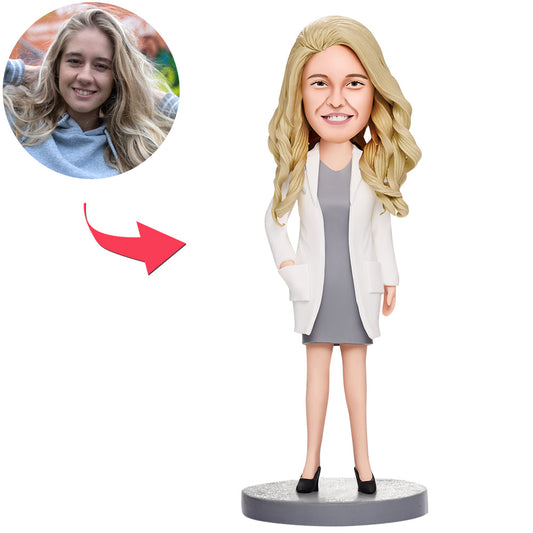 Personalised female doctor bobblehead in white dress with heart detail and engraved text — custom polymer clay doctor figurine personalised from photo