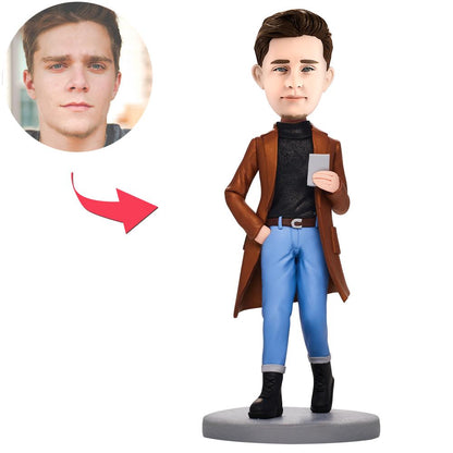 Personalised polymer clay bobblehead of a casual man holding a phone — handcrafted custom bobble head with engraved name on the base, ideal engraved bobblehead gift