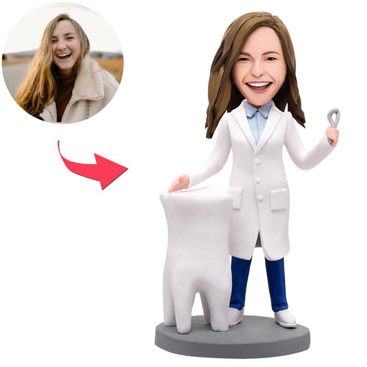 Handmade personalised female dentist bobblehead in dental uniform — polymer clay custom head sculpted from your photos with engraved text on the base, ideal graduation gift for dentists