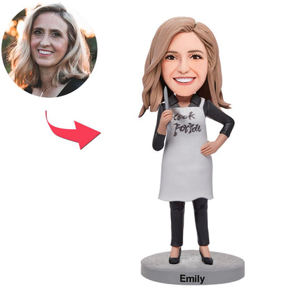 Personalised female chef bobblehead — handcrafted polymer clay figurine with custom head modelled from your photo and engraved text on the base