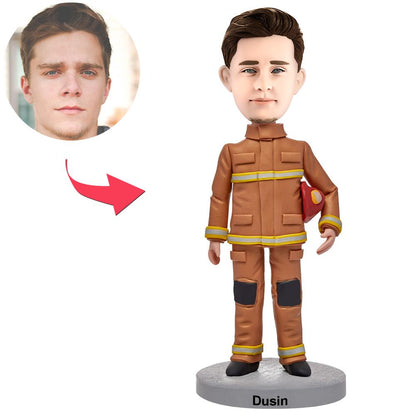 Personalised male firefighter bobblehead in uniform with engraved text on base, polymer clay customised head matched to photo, front view ideal personalised firefighter gift