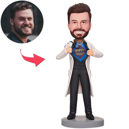 Personalised male doctor bobblehead in polymer clay, full-length front view wearing white coat and stethoscope with engraved base for custom text, ideal personalised medical gift