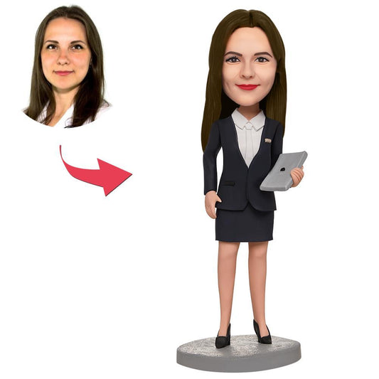 Personalised polymer clay businesswoman bobblehead holding a laptop with customised sculpted face and engraved base — bespoke personalised bobblehead gift for her, perfect for office desk, work anniversary (UK & Australia)