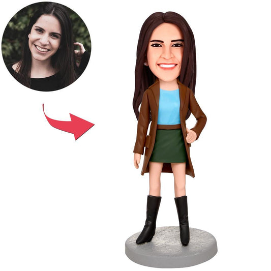 Need For Speed woman personalised bobblehead with engraved text — custom head sculpted from your photo in high‑quality polymer clay, posed in a racing outfit; personalised keepsake and collectible gift for fans in the UK and Australia