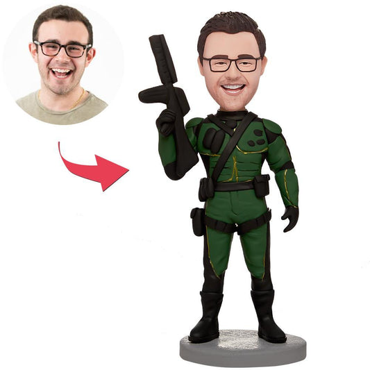 Personalised male bobblehead holding a gun – polymer clay figurine with customised head and engraved text on the base (name, date or short quote), ideal unique gift