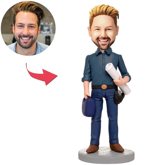 Front view of personalised engineer bobblehead with tools and engraved text on the base - hand-crafted polymer clay desk ornament, perfect personalised graduation or mentor gift