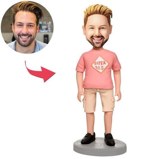 Front view of a custom pink-clad man polymer clay bobblehead with engraved text on the base — personalised bobblehead, custom bobble head, ideal personalised gift in Australia and the UK