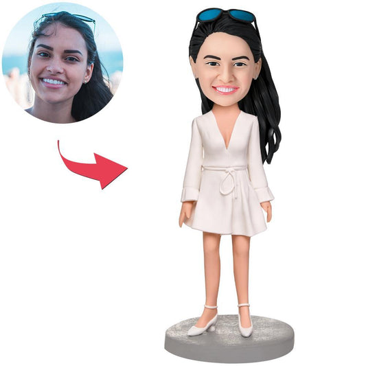 Personalised girl bobblehead in white dress, handcrafted polymer clay figurine with photo-customised head and engraved text on the base — ideal personalised gift for bridesmaids and birthdays in the UK and Australia