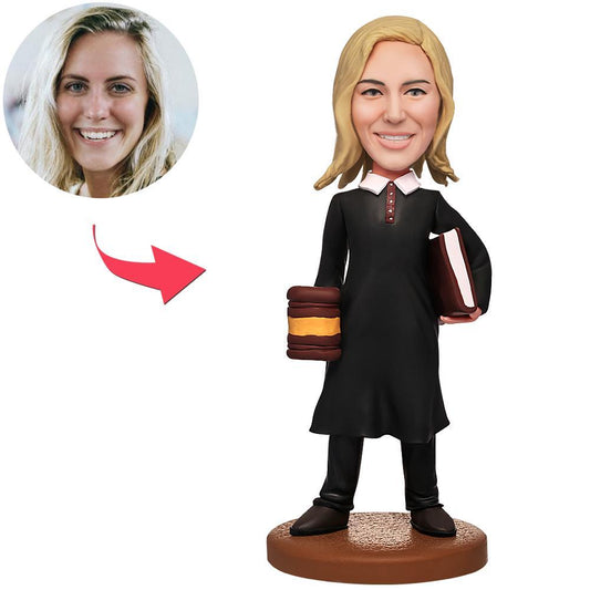 Personalised female judge bobblehead with custom face from photo, hand‑modelled polymer clay and engraved base text — perfect law graduation or barrister gift