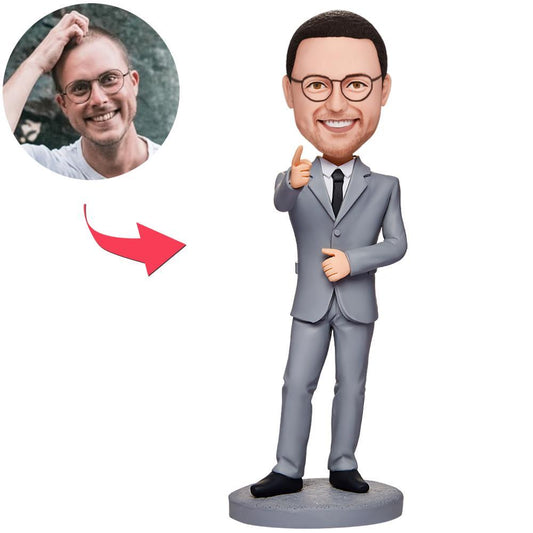 Business Man 'Believe In Yourself' custom bobblehead on engraved base — handmade polymer clay figure with a personalised head from a photo, ideal corporate gift; personalised bobblehead UK, custom bobblehead Australia.