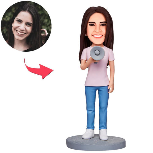 Front view of female holding a megaphone personalised bobblehead with engraved base — polymer clay custom bobblehead gift