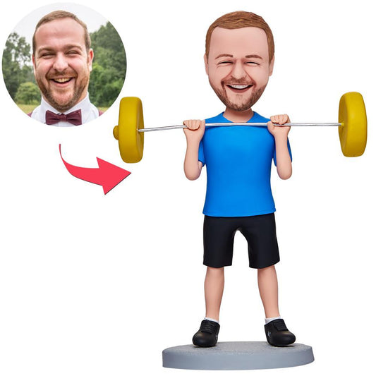 Custom weightlifter bobblehead with personalised head and engraved text on the base, male polymer clay figurine holding a barbell — ideal custom gym bobble head and personalised weightlifting figurine